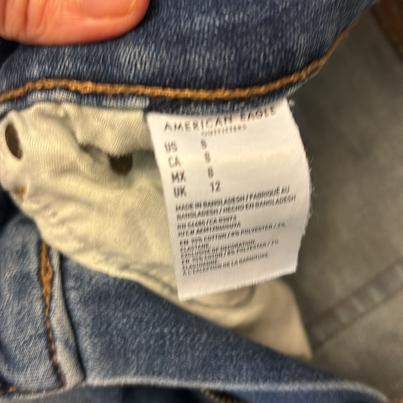 Size 8 American Eagle rolled stretch denim shorts with frayed patches. - Picture 4 of 5
